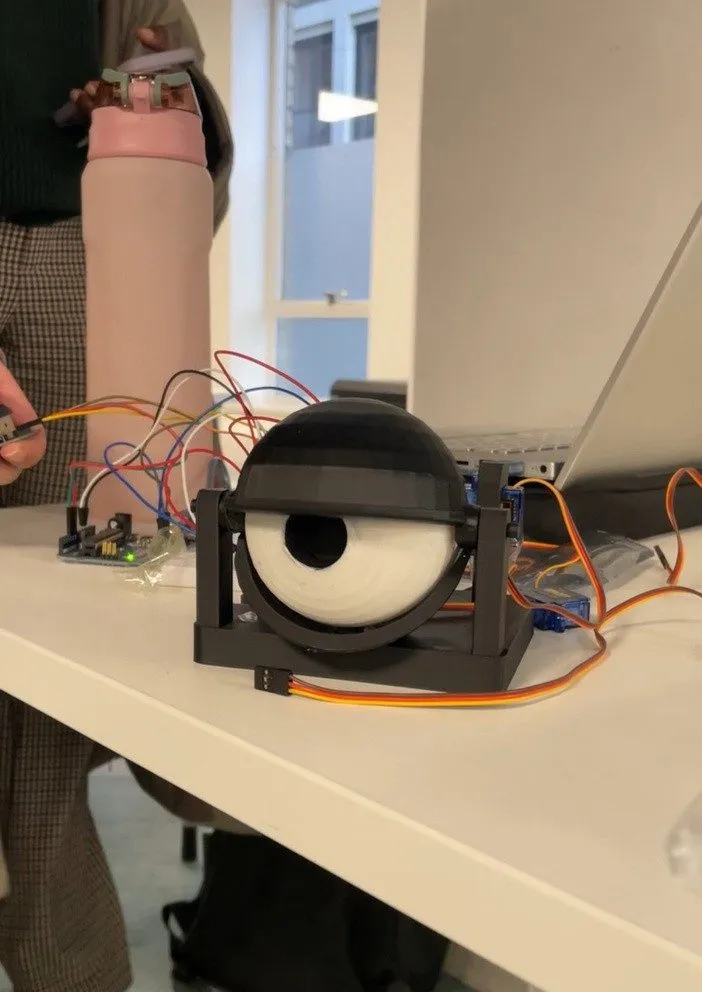 A 3D-printed servo-driven robotic eyeball wired to a breadboard